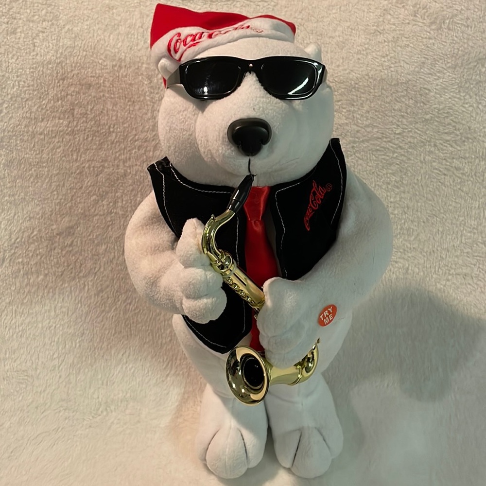 Coca-Cola Polar Bear Plays Saxophone&Dances to Rockin Around the Christmas Tree!